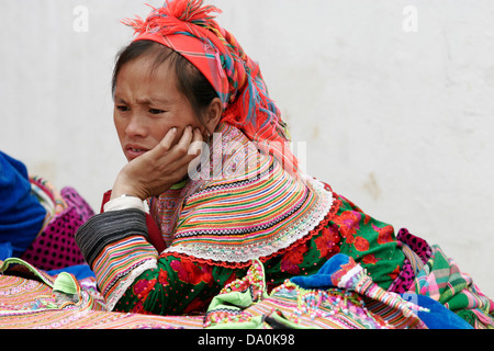 Young Flower Hmong woman at the market in Bac Ha, Vietnam, Southeast Asia Stock Photo