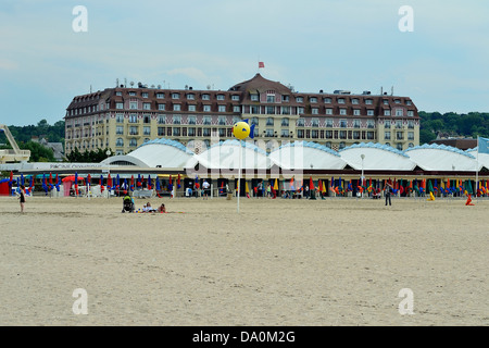 Deauville, the beach, Royal hotel in the back ground, 'Corniche Normande' road (Calvados, Normandy, France). Stock Photo