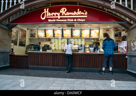A Harry Ramsden's fish and chip shop at the McArthur Glenn outlet village in Swindon, Wiltshire, UK Stock Photo