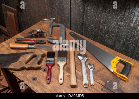 A few essential tools, Timber Saw, G Clamp, No 4 Plane, Wrench set, Pliers, Paint Brushes and a Hammer Stock Photo