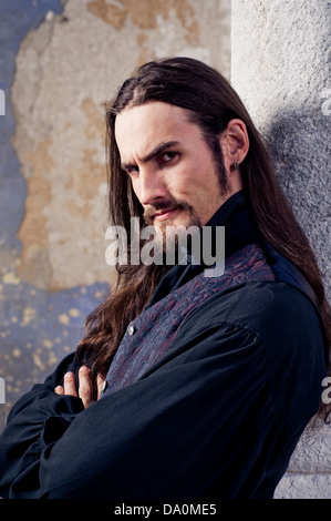 Handsome man with long hair Stock Photo