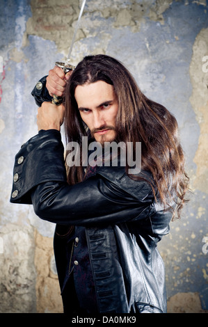 Goth man with long hair Stock Photo