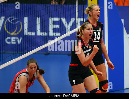Corina Ssuschke-Voigt (C) and  Margareta Anna Kozuch of the women's national volleyball team celebrate a point during the Europa League group match between Germany and Belgium at CU Arena in Hamburg, Germany, 29 June 2013. Photo: Axel Heimken Stock Photo
