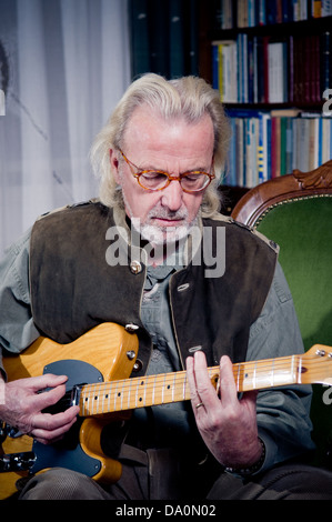 Senior man playing guitar Stock Photo