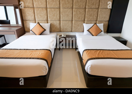 Two beds in hotel room Stock Photo