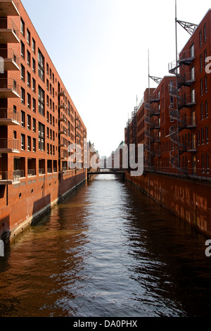 View down a canal between Amundsen and Vespucci houses at Hanseatic Trade Center in Hamburg, Germany. Stock Photo
