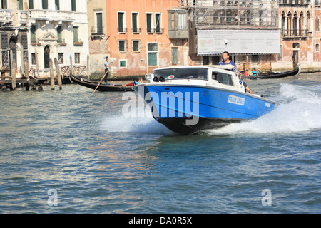 Venetian police boat, Grand Canal, Venice Stock Photo