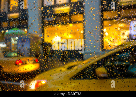 taxi rain new york city yellow cab street USA Stock Photo