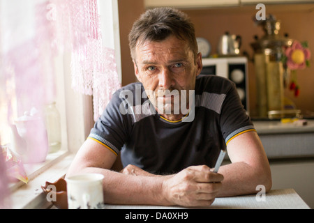 Portrait of a man farmer in his rural home. Stock Photo