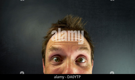 A surprised expression on a mans face Stock Photo