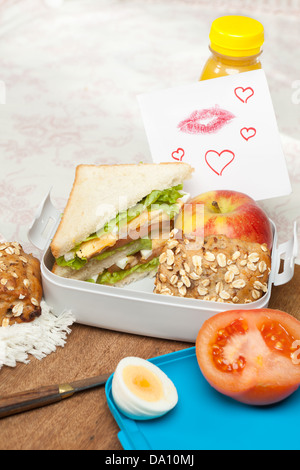 Love note with lipstick kisses in a lunchbox Stock Photo