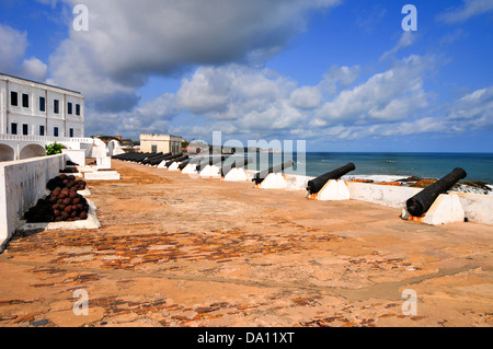 Cannons overlooking from Cape Coast Castle. Cape Coast Castle is a fortification in Ghana built by Swedish traders for trade. Stock Photo