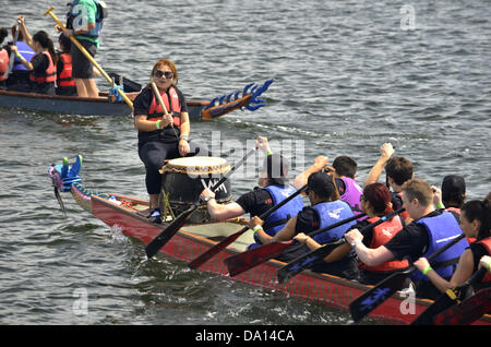 London, UK. 30th June, 2013. Dragon boats race on Royal Albert Dock beside London City Airport. The annual Dragon Boat Festival is hosted by London Chinatown Lions Club and is in its 18th year. Credit:  Marcin Libera/Alamy Live News Stock Photo