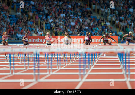 Birmingham, UK. 30th June 2013. Dawn Harper-Nelson (third from right) of the United States finshes 1st in the women's 100m hurdles at the 2013 Sainsbury's Birmingham Grand Prix Diamond League meeting. The former Olympic champion's time of 12.64 seconds was enough to beat fellow American Kellie Wells (second from left) and Tiffany Porter (centre) of Great Britain. Credit:  Russell Hart/Alamy Live News. Stock Photo