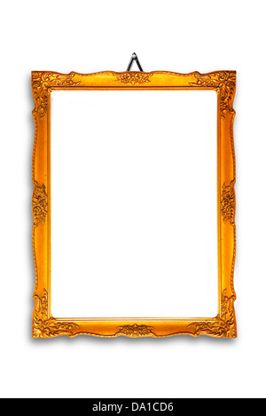 gold plated wooden picture frame hanging on a white wall Stock Photo