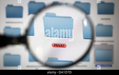 ILLUSTRATION - An illustartion dated 01 July 2013 shows a folder icon on a computer screen saying 'Private' (Privat) enlarged with a magnifying glass in Kaufbeuren, Germany. Photo: Karl-Josef Hildenbrand Stock Photo