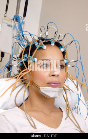 EEG EXAMINATION OF A WOMAN Stock Photo