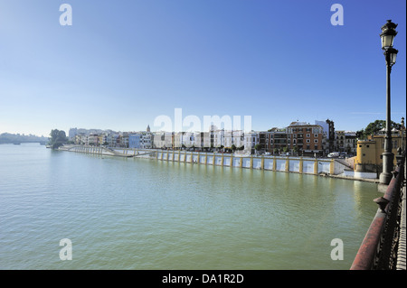 view of Triana and Guadalquivir river from the Isabel II bridge (Triana Bridge), Seville, Spain Stock Photo