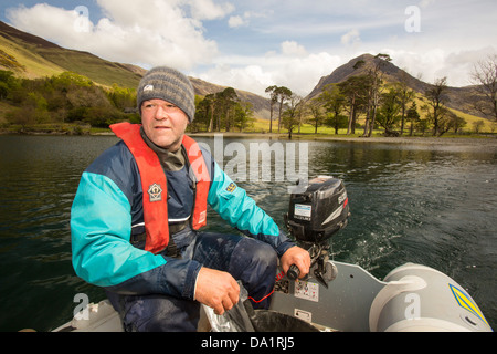 Dr Jeff Warburton of Durham University preparing to take sediment cores from the bottom of Buttermere Stock Photo