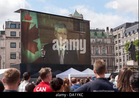 Trafalgar Square, London, UK. 1st July 2013. Canada Day 2013, the 8th to be held in Trafalgar Square and Canada's 146th Birthday celebration. Canadian Prime Minister Stephen Harper addresses the crowds at the start of the day. Credit:  Rena Pearl/Alamy Live News Stock Photo