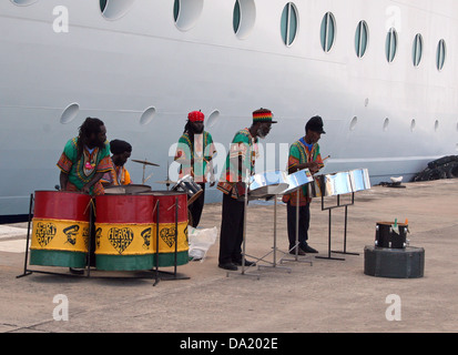 Steel drum band performs on the docks next to a cruise ship, St. John's, Wadadli, Antigua and Barbuda