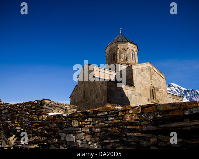 The Gergeti Trinity Church (Tsminda Sameba) in Caucasus Mountains in Georgia. Stock Photo