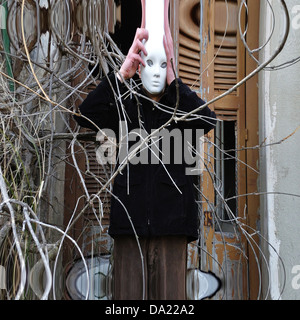 Distorted figure of man with white mask. State of confusion. Stock Photo