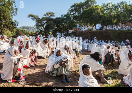 Pilgrims with the traditional white shawl attending a lecture at the Bete Medhane Alem Church, Lalibela, Ethiopia Stock Photo
