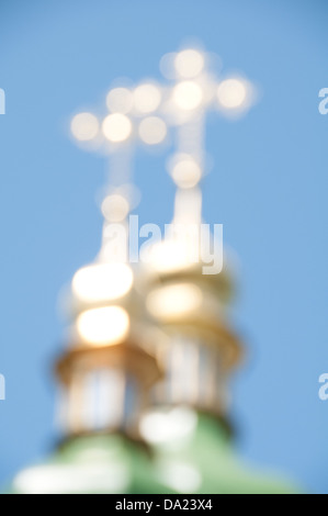 Blurred gold crosses on a background of the sky. Stock Photo