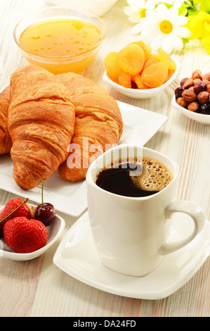 breakfast with fresh coffee, fresh croissants and fruits Stock Photo ...