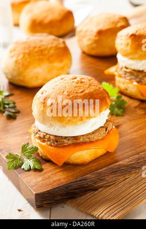 Homemade Egg Sandwich with Sausage and Cheese on a Roll Stock Photo