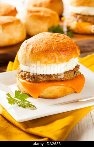 Homemade Egg Sandwich with Sausage and Cheese on a Roll Stock Photo