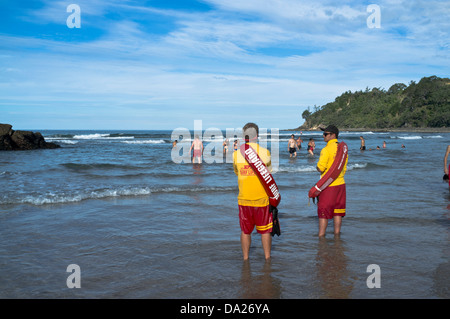 dh Hot Water Beach COROMANDEL NEW ZEALAND Surf Lifeguards watching swimmer dangerous rip undertows lifeguard looking out peninsula beaches surfing Stock Photo