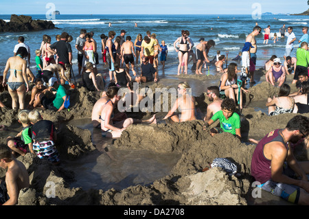 dh Hot Water Beach COROMANDEL NEW ZEALAND People lying in springs thermal pools geothermal peninsula Stock Photo