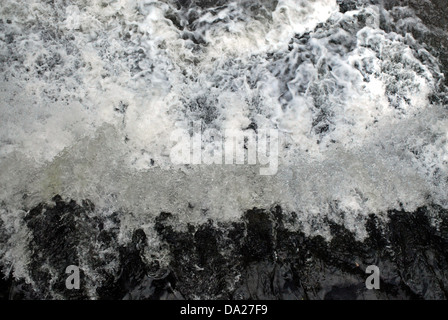 Water churning and foaming on waterfall. Stock Photo
