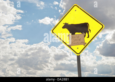 A yard sale sign is hard to miss in the small town of Anton Chico in a rural section of New Mexico. Stock Photo