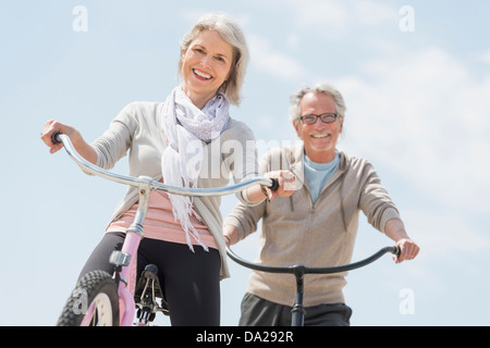 Senior couple riding bicycle Stock Photo