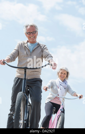 Senior couple riding bicycle Stock Photo