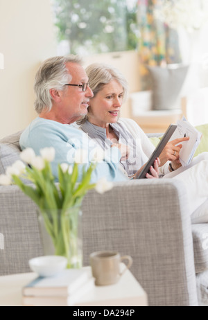 Senior couple paying bills via internet Stock Photo