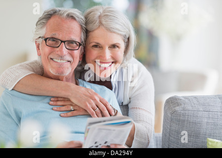 Senior woman embracing senior man Stock Photo