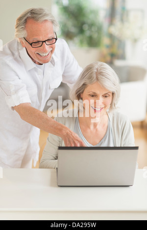 Senior couple using laptop Stock Photo
