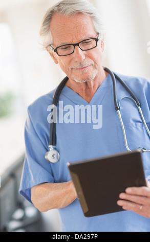 Male doctor using digital tablet Stock Photo
