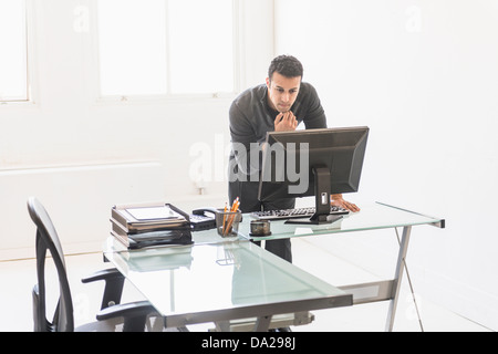Businessman working at desk Stock Photo