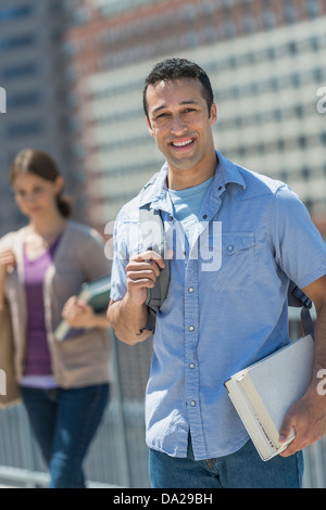 Male and female students in campus Stock Photo