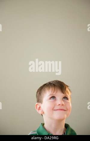 Portrait of boy (4-5) daydreaming Stock Photo