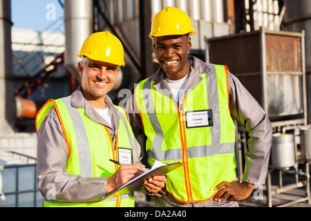 oil and chemical co-workers in refinery plant Stock Photo