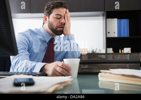 Portrait of overworked man Stock Photo