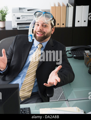 Portrait of businessman dreaming about vacation Stock Photo