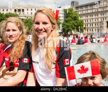London, UK. 1st July 2013. Young Canadians celebrate Canada Day in Trafalgar Square. London Credit:  wanderworldimages/Alamy Live News Stock Photo