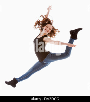 Portrait of jumping girl (12-13) Stock Photo